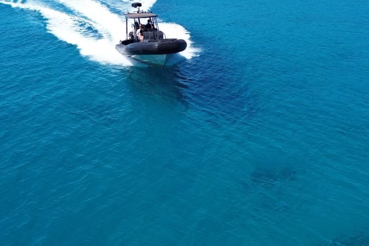 a small boat in a body of water