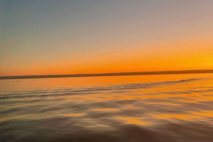 a sunset over a body of water